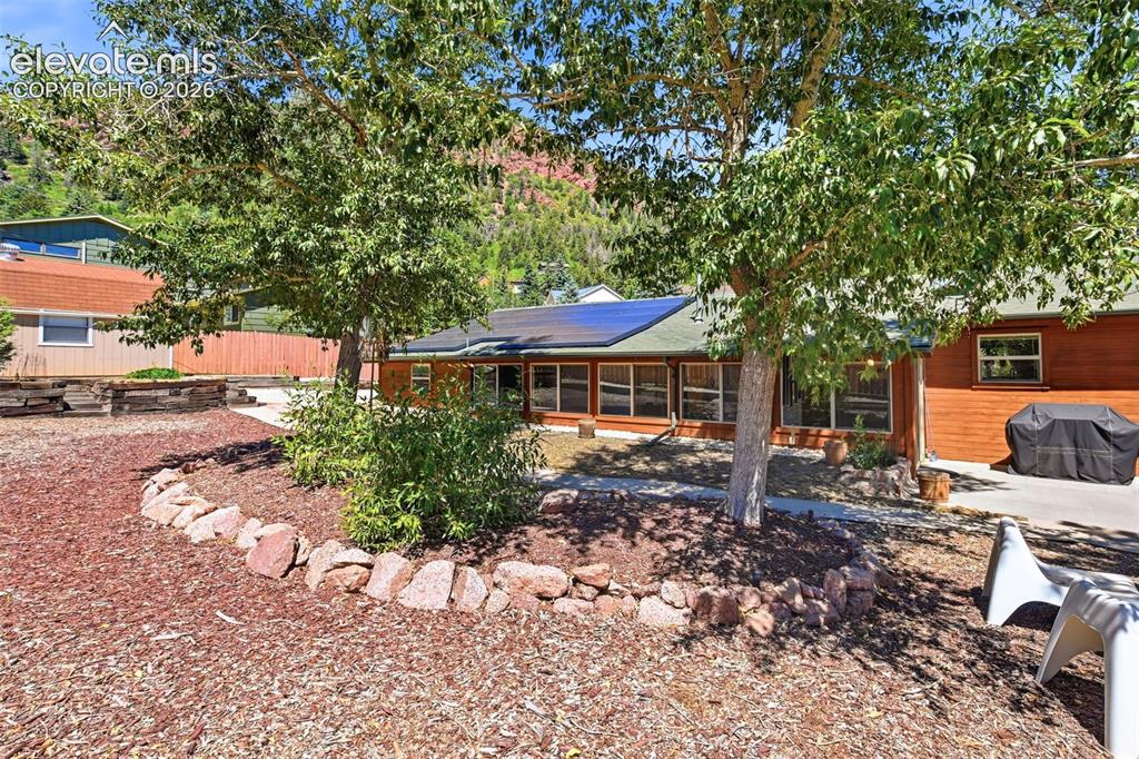 Image 39 of 50: The property features a wood-sided exterior with a sloped roof