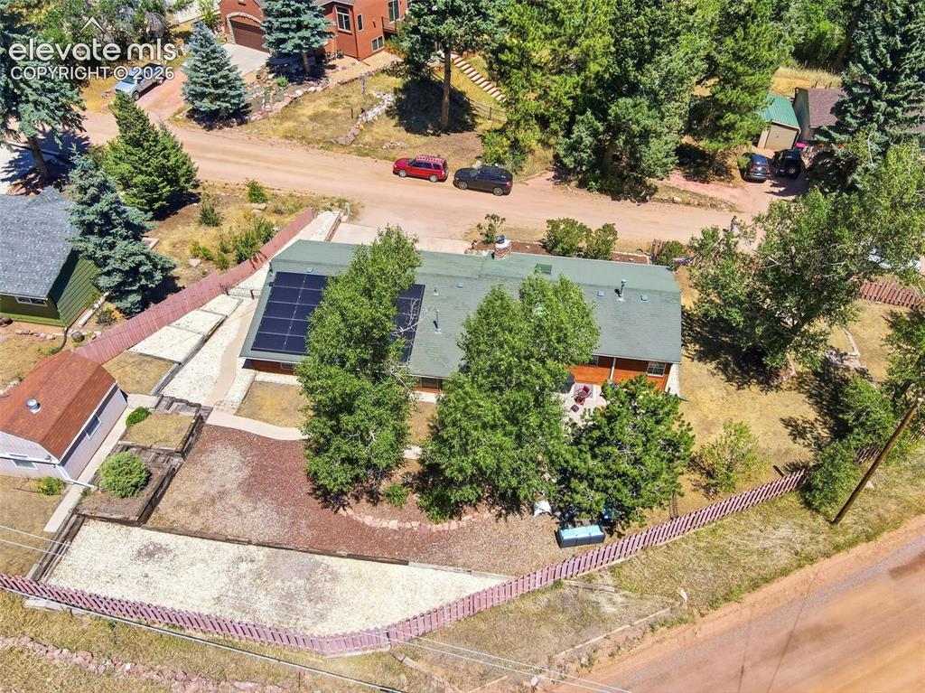 Image 44 of 50: Property featuring a green roof and solar panel array