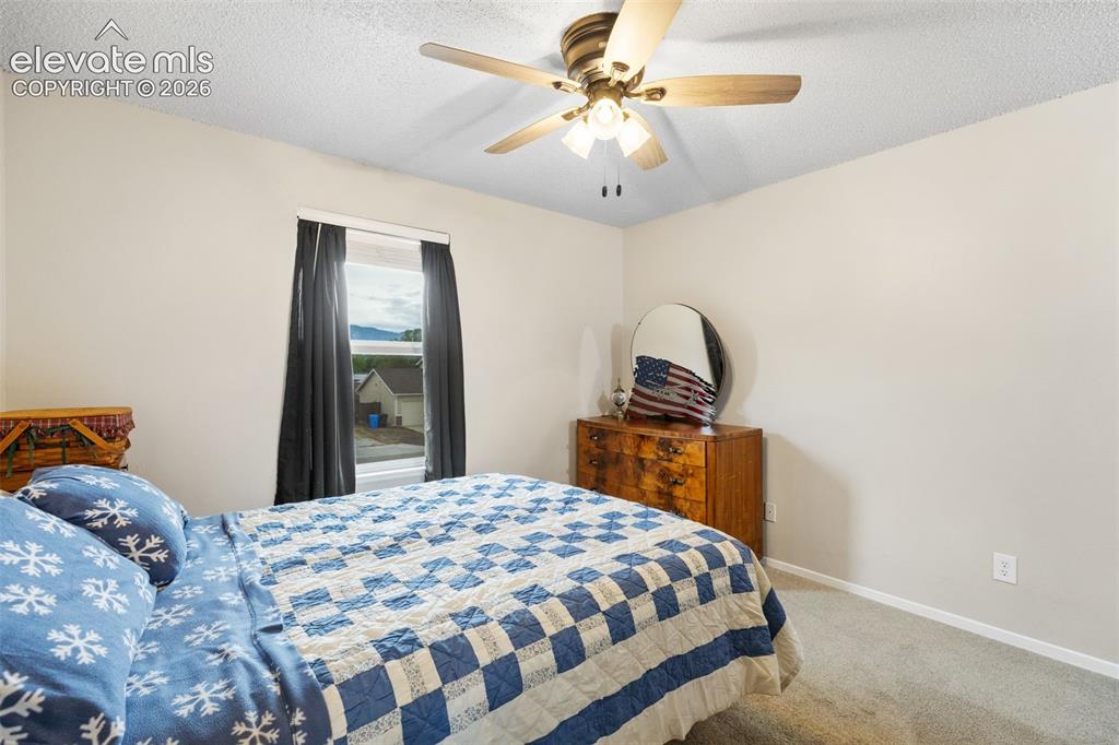 Image 13 of 28: Retreat upstairs to the primary suite, featuring mountain views, a walk-in 