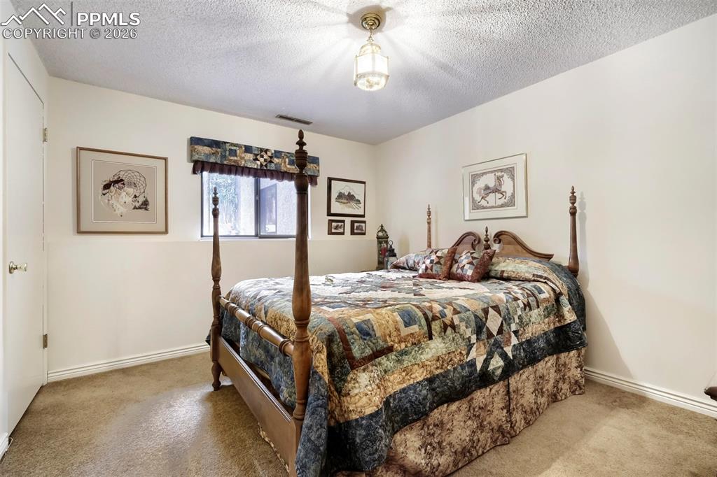 Image 17 of 42: Basement bedroom