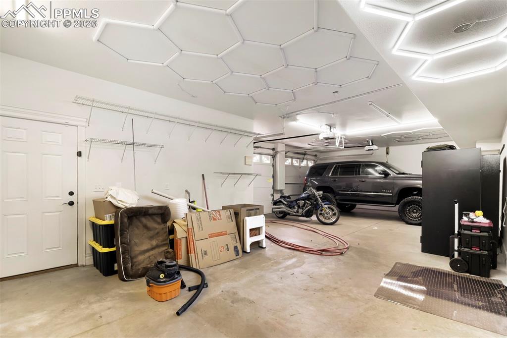 Image 32 of 42: 2nd quarters garage and shop area/2 more bays also