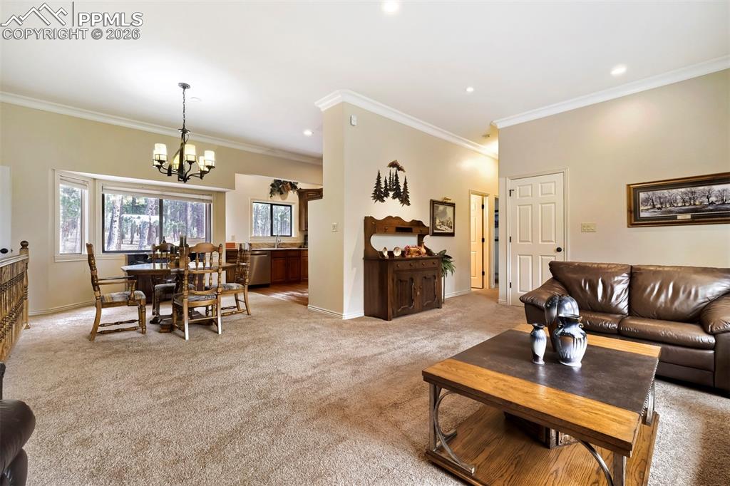 Image 7 of 42: Living room and dining area in main home