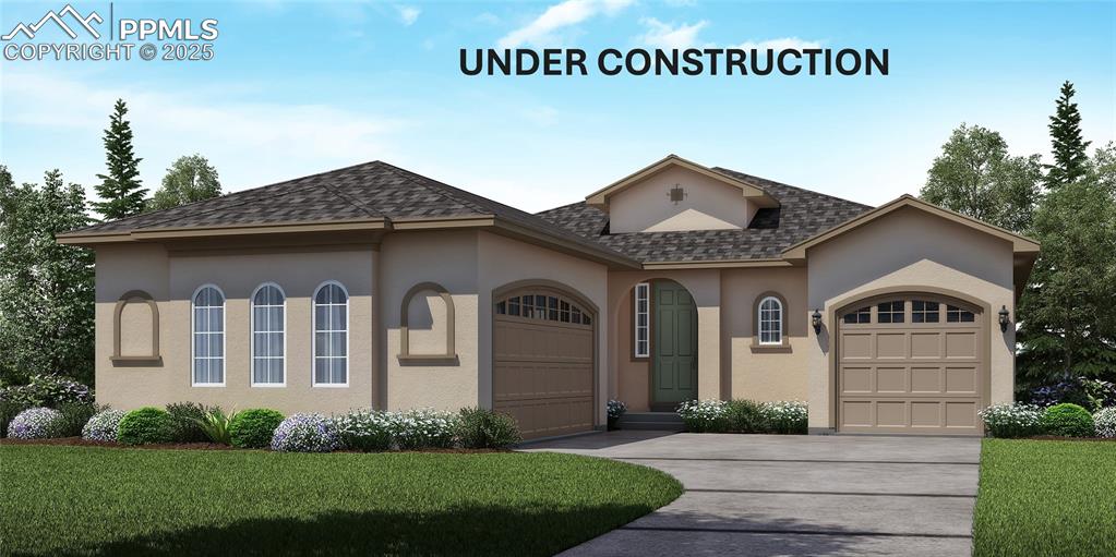 Caption: View of front of house with a garage, driveway, stucco siding, and a front lawn