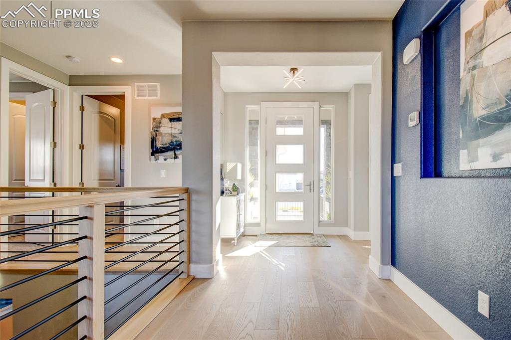 Image 11 of 30: Entrance foyer with light wood-type flooring and recessed lighting
