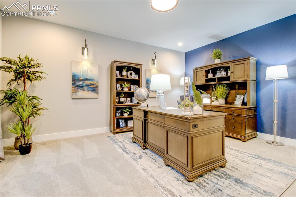 Image 21 of 30: Office space featuring light carpet and recessed lighting