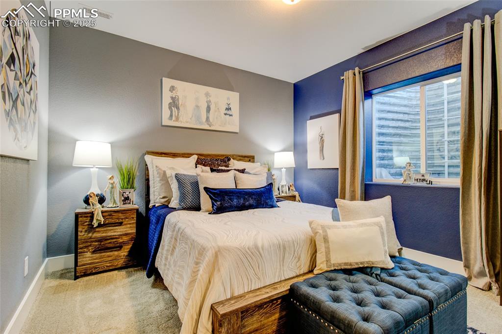 Image 30 of 30: Bedroom with carpet and baseboards