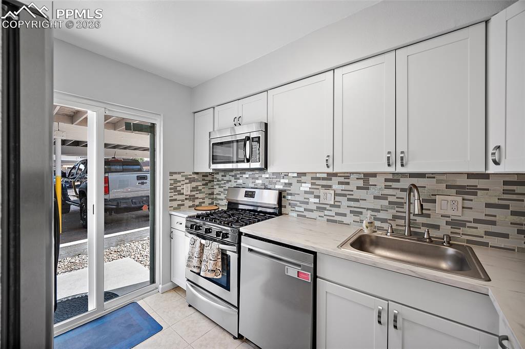 Image 7 of 40: Wonderful, updated kitchen with all stainless-steel appliances. 