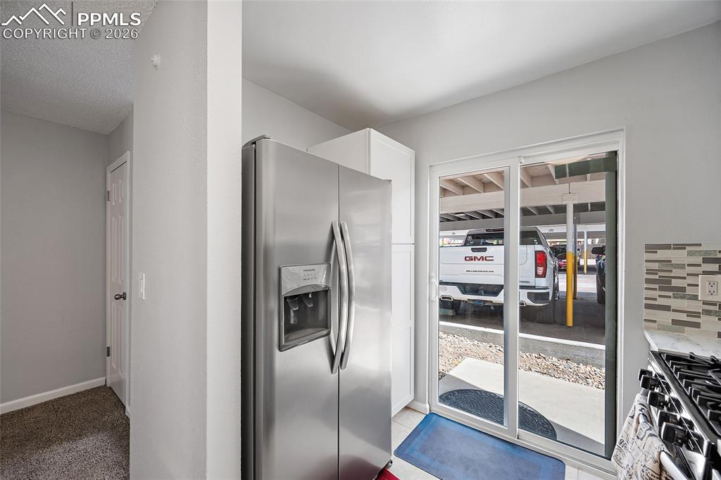 Image 9 of 44: Sliding Glass doors off the kitchen. Perfect for your BBQ