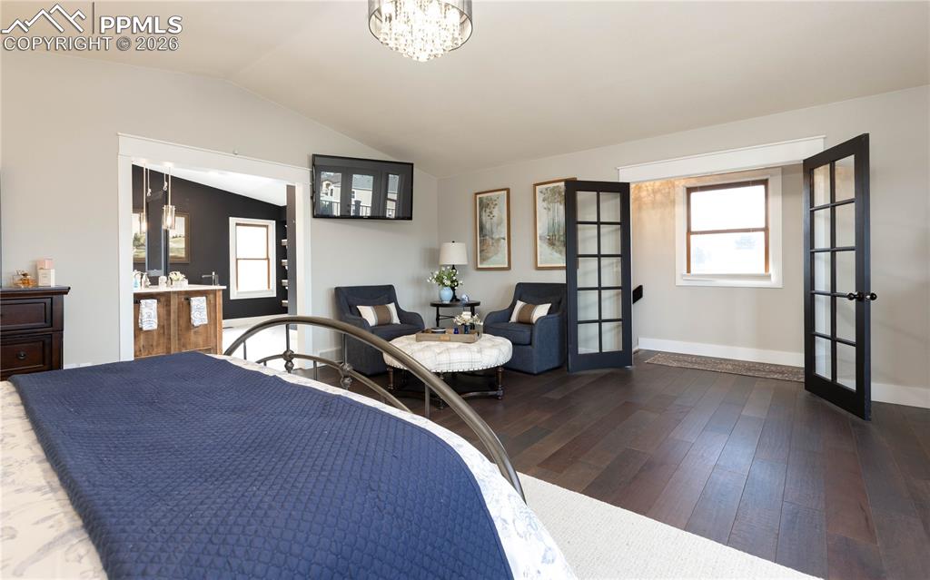 Image 25 of 42: Primary retreat with 
french doors to create a private sanctuary on the up