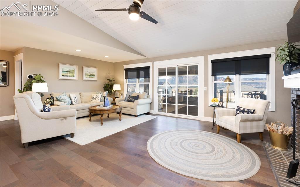 Image 3 of 42: Living Room with large windows to expansive views of the front range