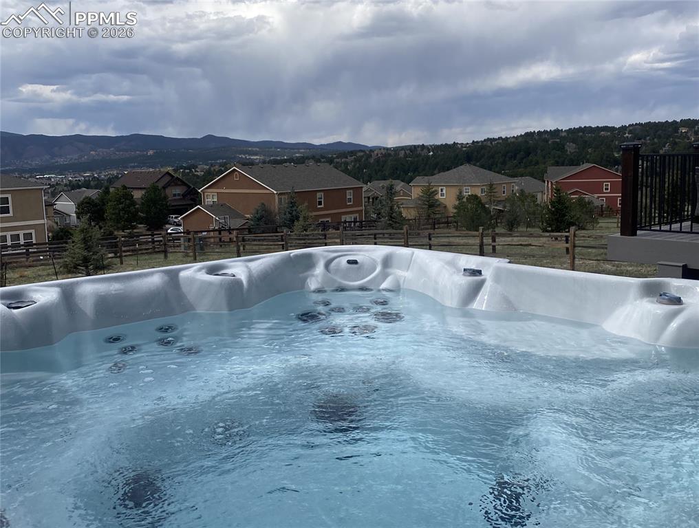 Image 34 of 42: Relax in the hot tub with this spectacular view