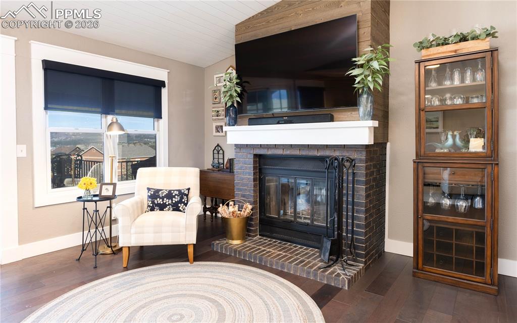 Image 4 of 42: Real wood-burning fireplace in living room