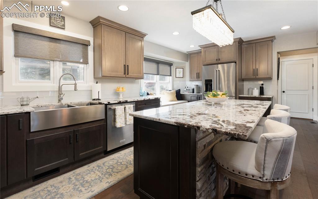 Image 6 of 42: Custom cabinetry and large island