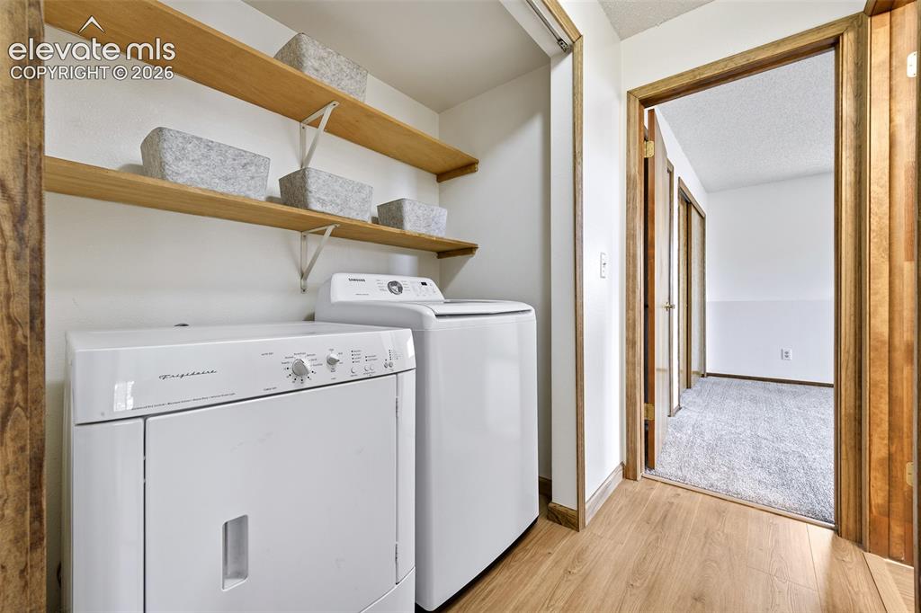 Image 16 of 45: Laundry in hall of lower level