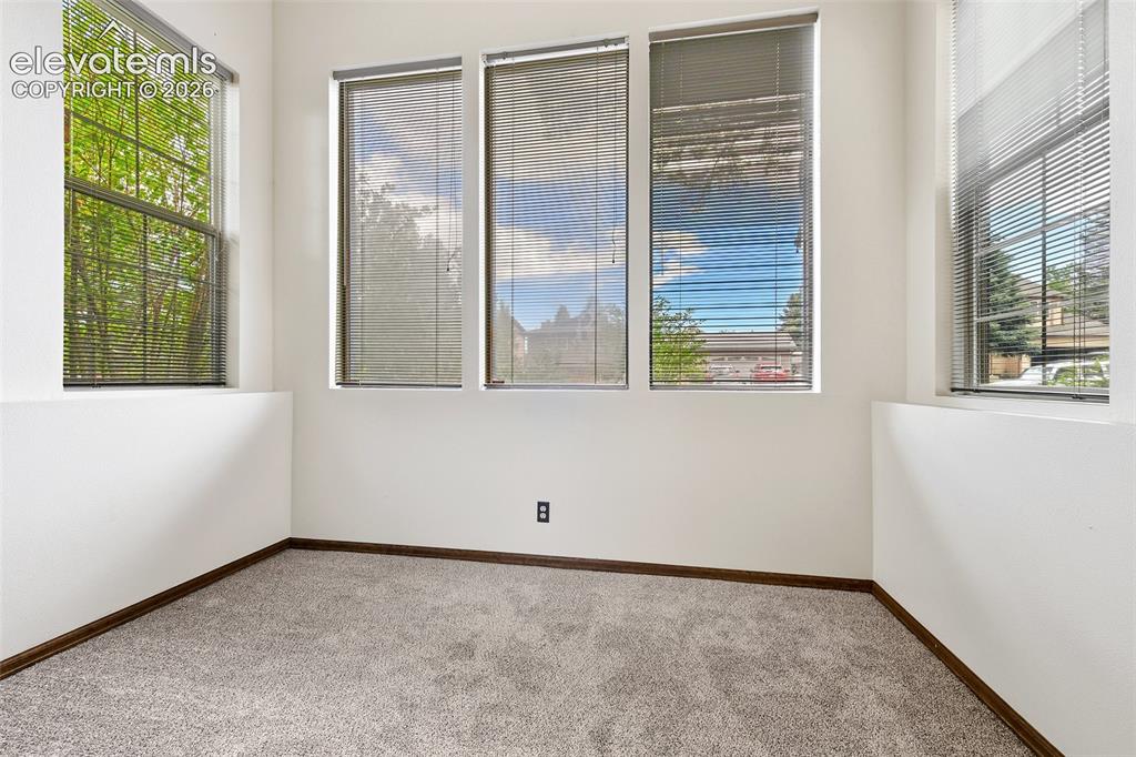 Image 19 of 45: Ancillary room with tall windows...the light is everywhere!