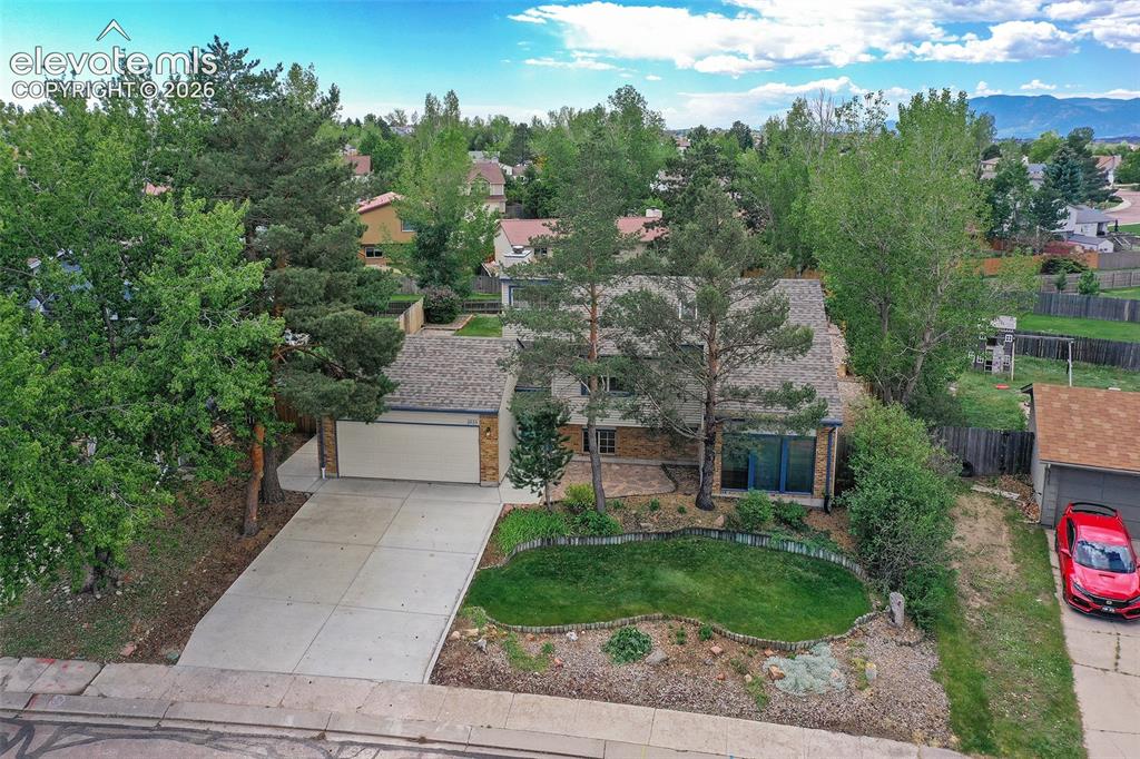 Image 2 of 45: With thoughtful mature landscaping that includes perrenials.