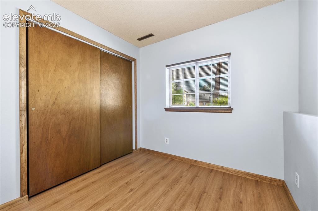 Image 21 of 45: 4th lower level bedroom has luxury vinyl flooring!