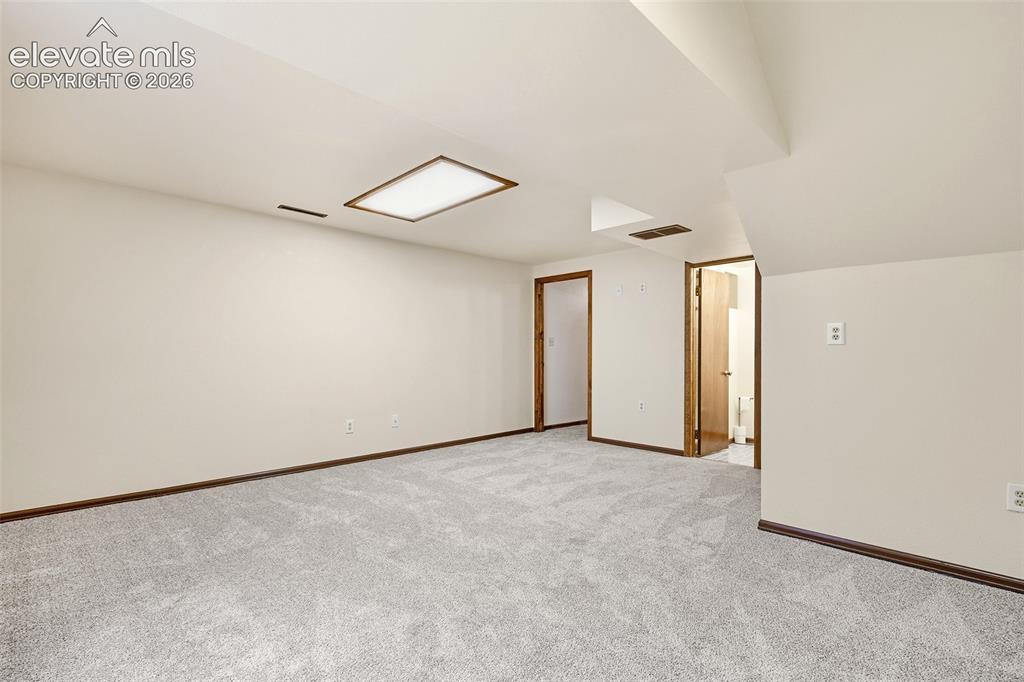 Image 22 of 45: Enormous family room in basement