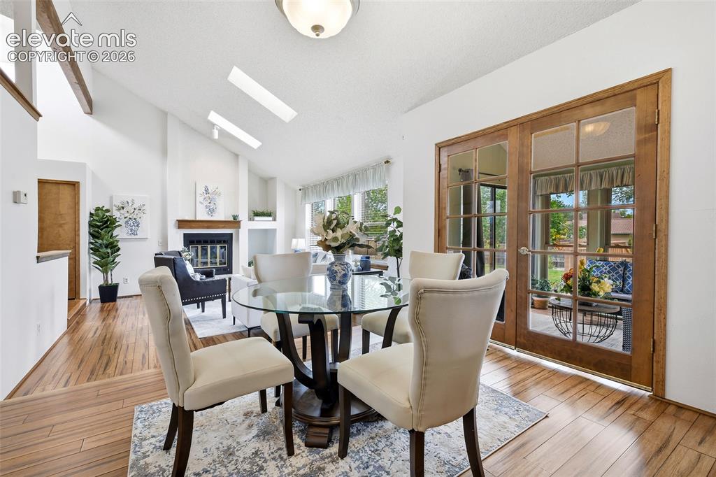 Image 8 of 45: Walkout off dining area leads to...