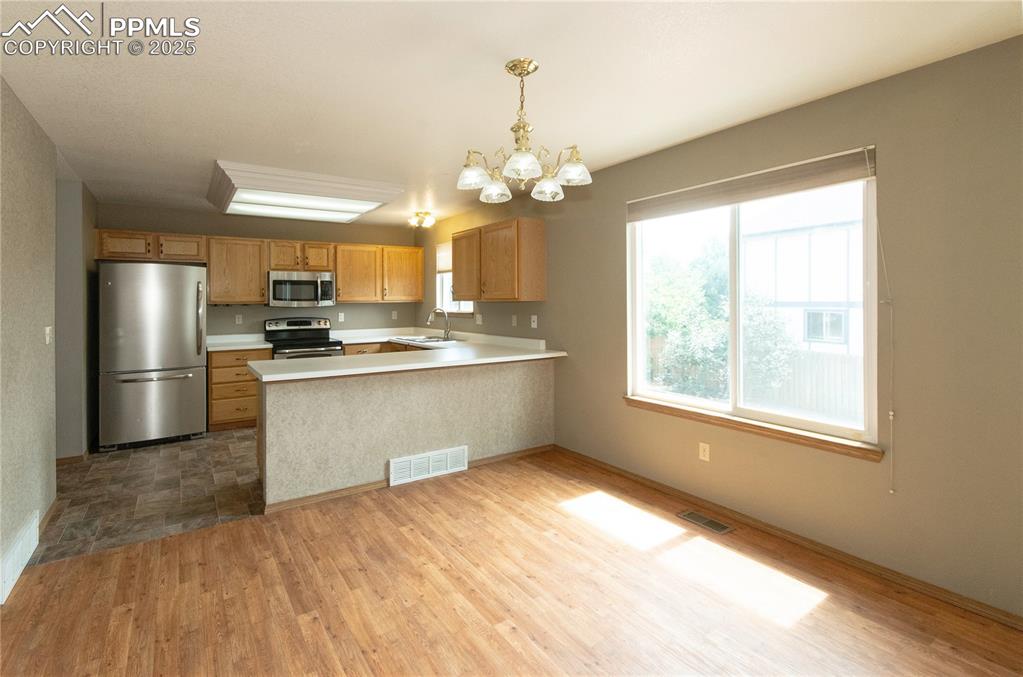 Image 11 of 41: Kitchen and dining area