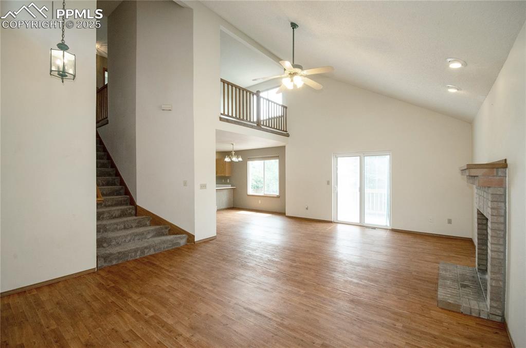 Image 5 of 41: hardwood flooring and walk out to back deck