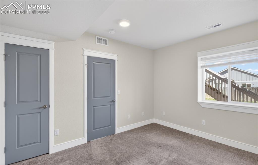 Image 22 of 28: Basement Bedroom