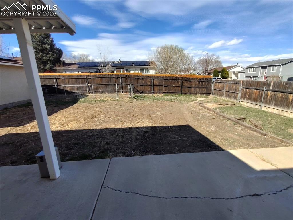 Image 41 of 45: Backyard view from the patio