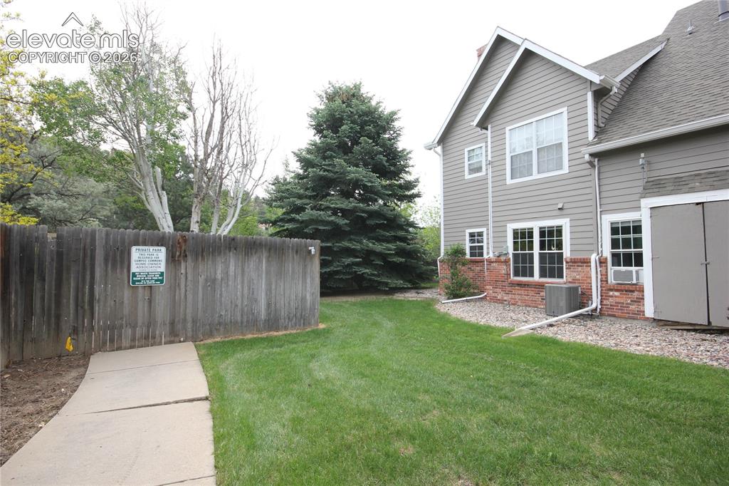 Caption: The property is the ground end  unit.  This is the north side of the property.