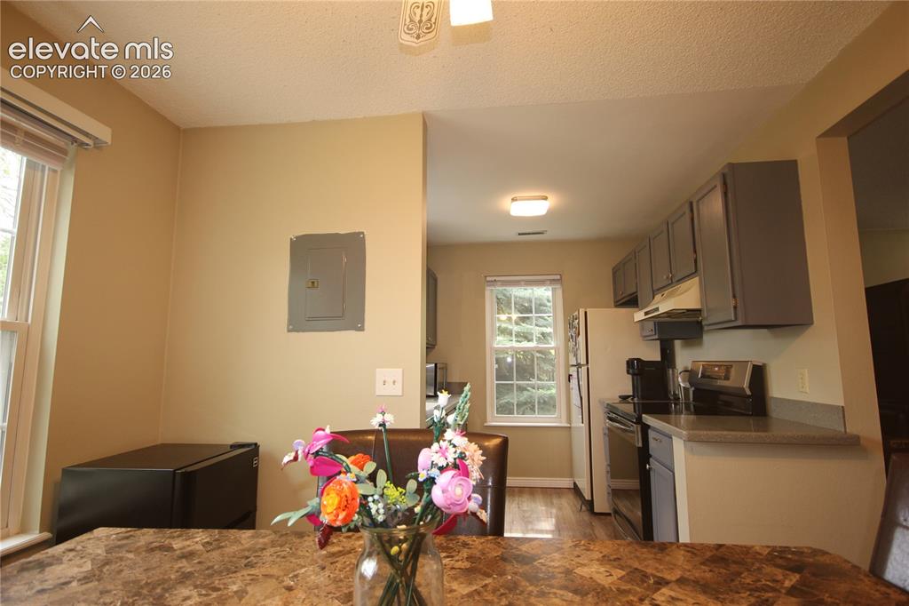 Image 11 of 33: View to the kitchen from Dining Area