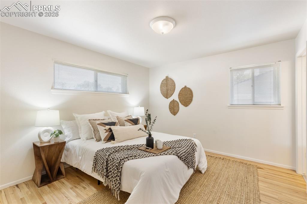 Image 14 of 31: PRIMARY BEDROOM WITH NEWLY REFINISHED HARDWOOD