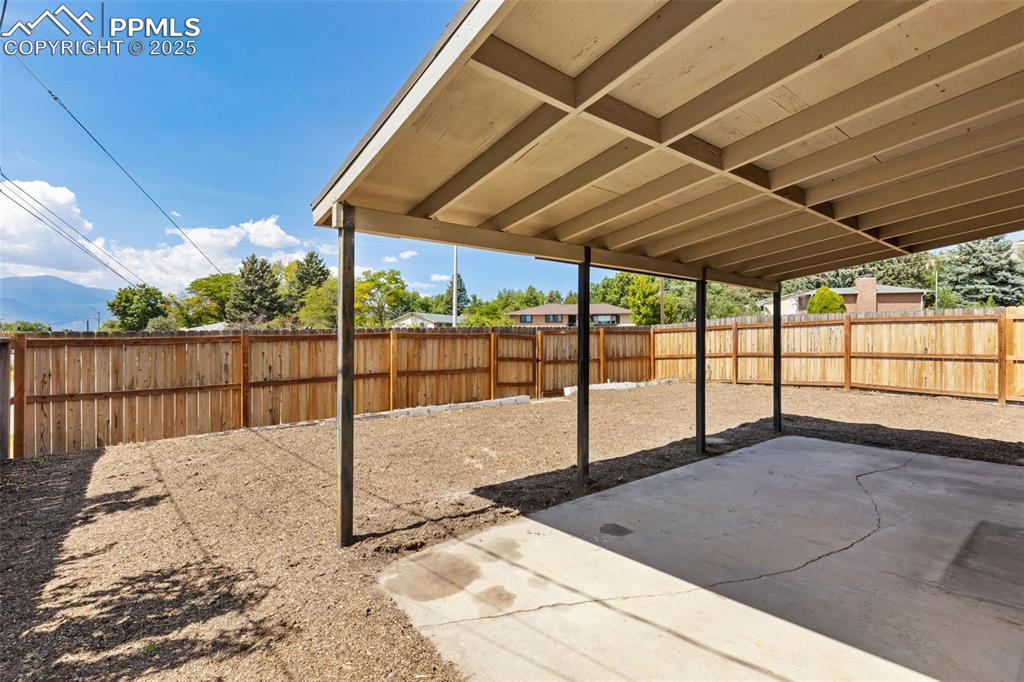 Image 23 of 31: ENJOY THE BACK COVERED PATIO & MOUNTAIN VIEWS