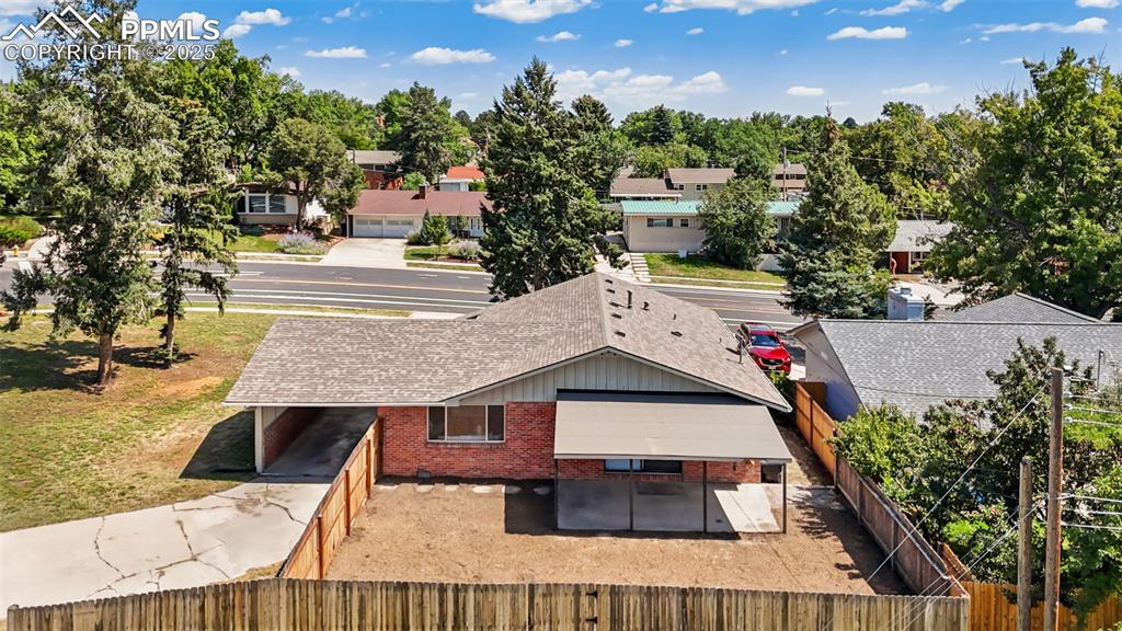Image 25 of 31: LARGE CORNER LOT WITH AERIAL VIEW OF BACKYARD