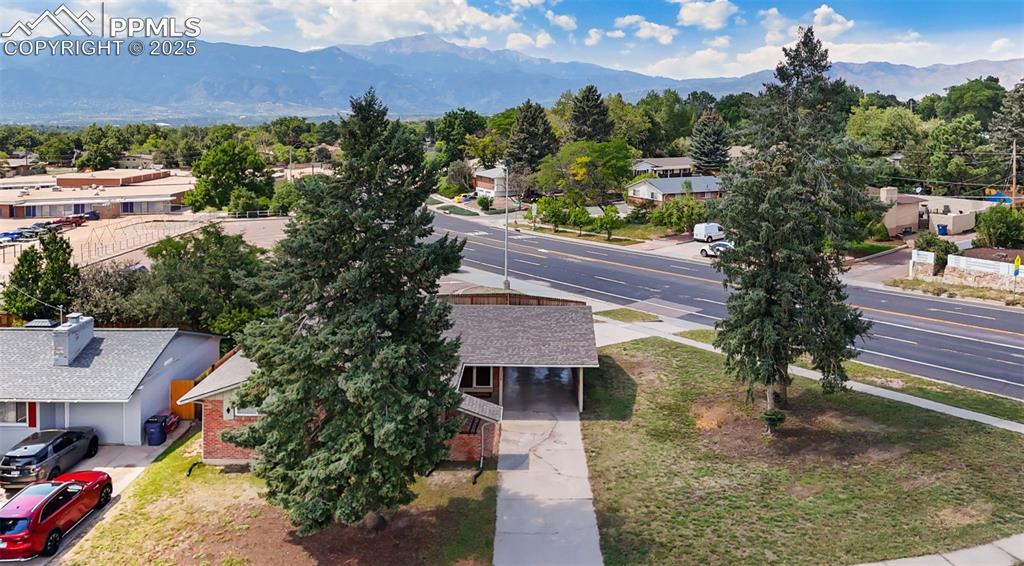 Image 30 of 31: AERIAL OF FRONT OF HOME WITH MOUNTAIN VIEWS