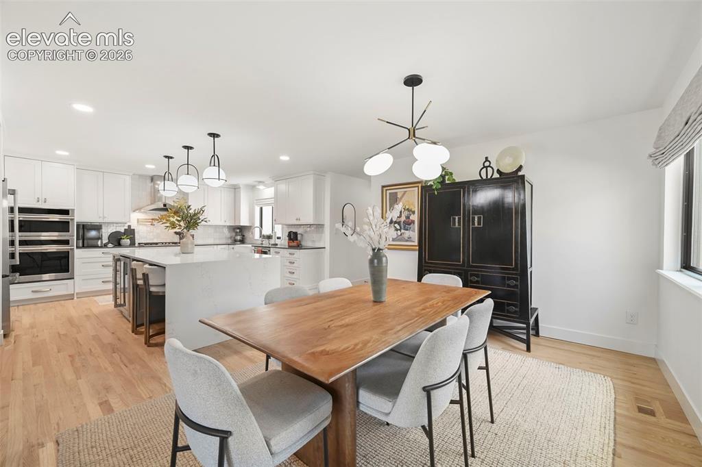 Image 14 of 50: Dining room open to the gourmet kitchen