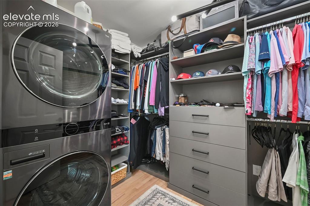 Image 25 of 50: 2nd closet in the primary bedroom with a washer and dryer