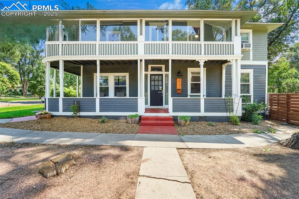 Image 2 of 28: View of front of home with covered porch