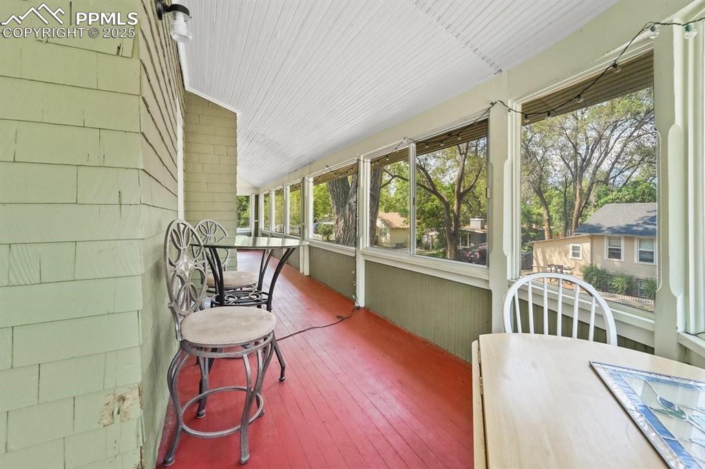 Image 24 of 28: Sunroom / solarium featuring lofted ceiling