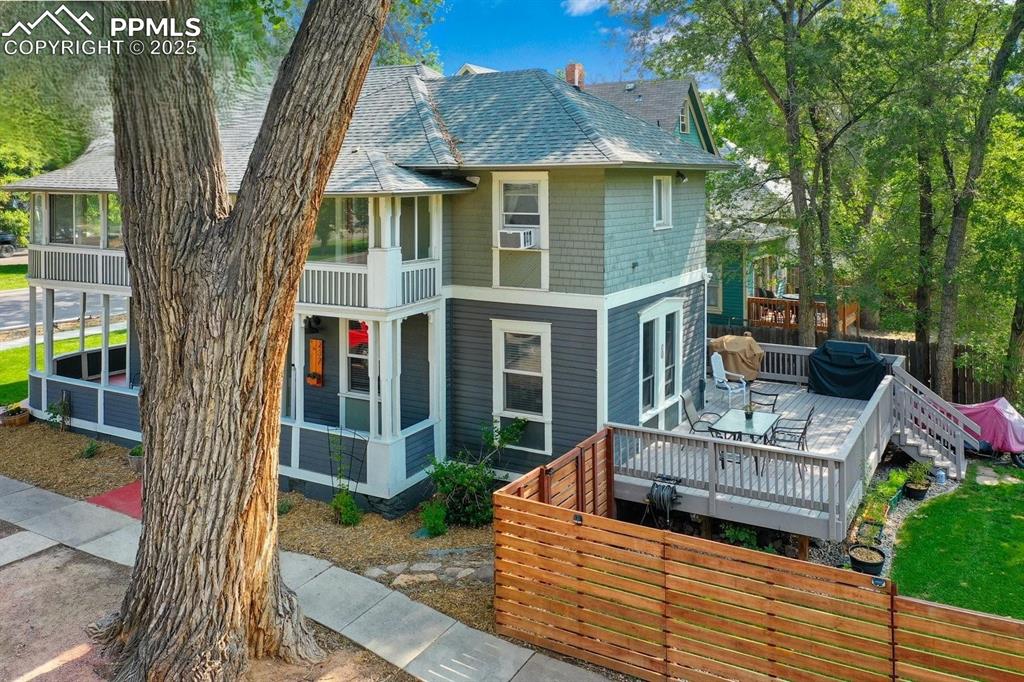 Image 3 of 28: View of front of home featuring a shingled roof and a deck