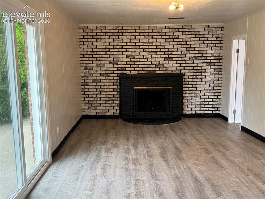 Image 14 of 18: Bonus Room in Garage w/Wood Burning Fireplace