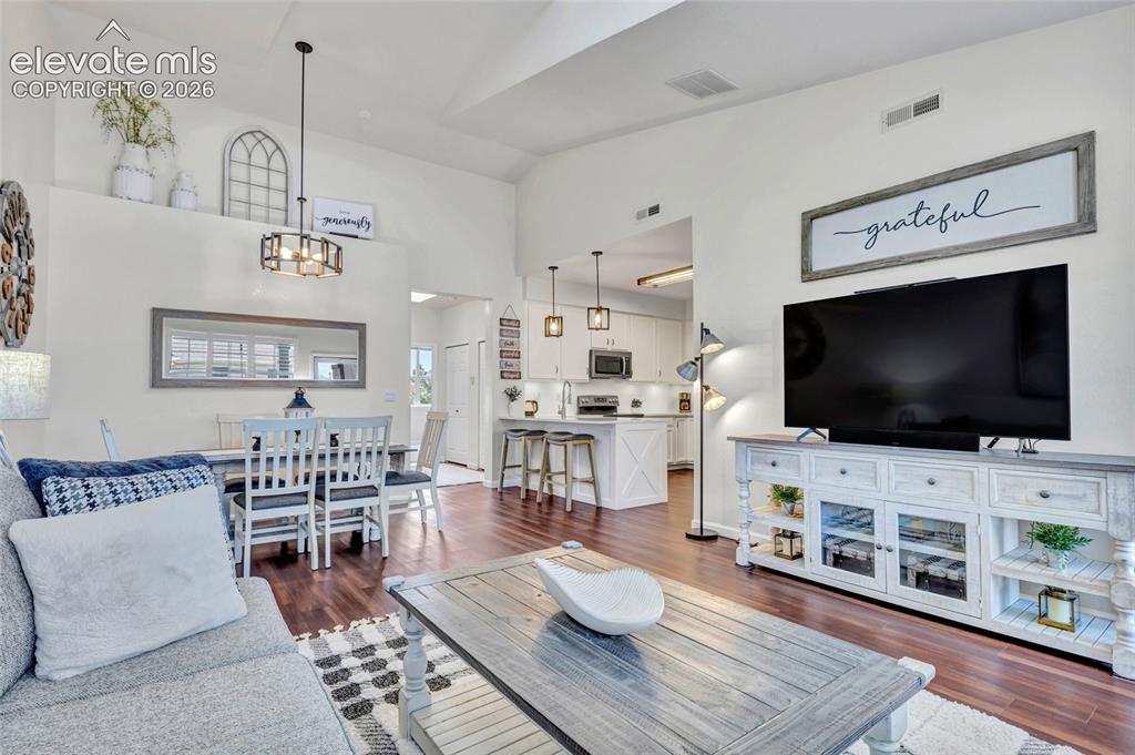 Image 7 of 26: A perfectly connected great room reveals the full flow of the home.
