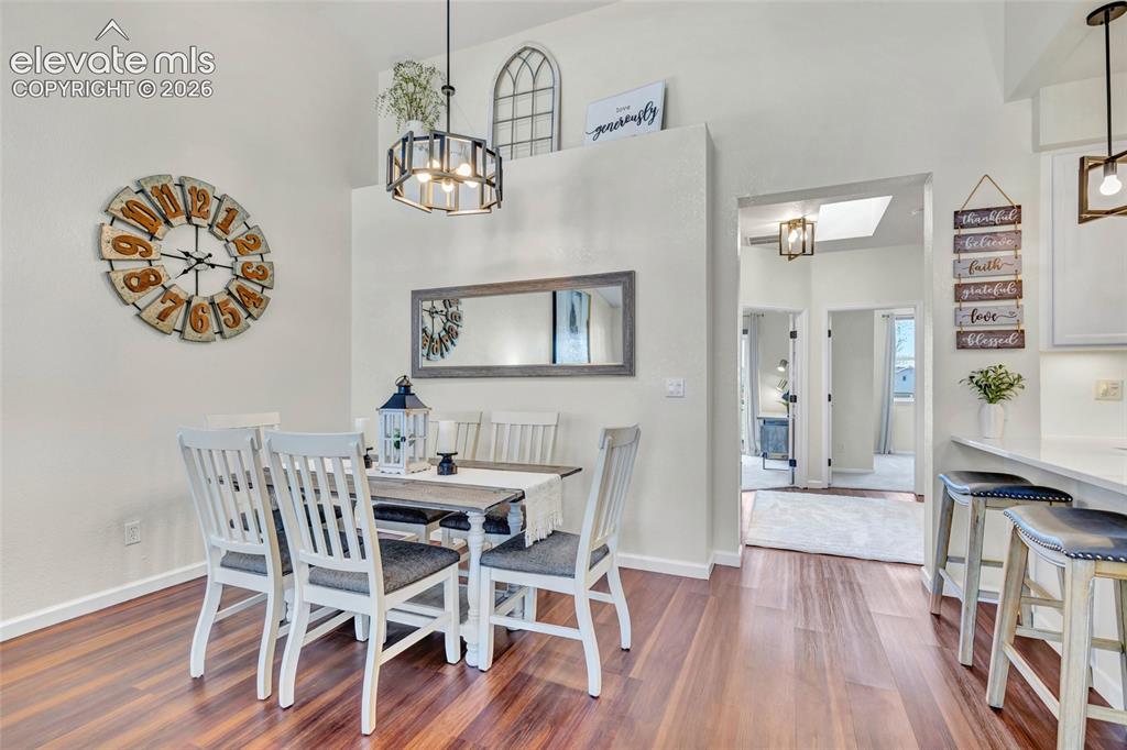Image 9 of 26: This dining space serves as the heart of the home, with sight-lines connect