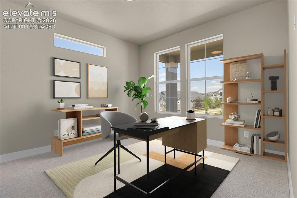 Image 17 of 42: Main level bedroom or office space. Virtually Staged