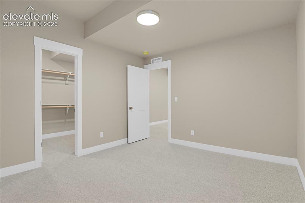 Image 24 of 42: Third bedroom with huge walk-in closet
