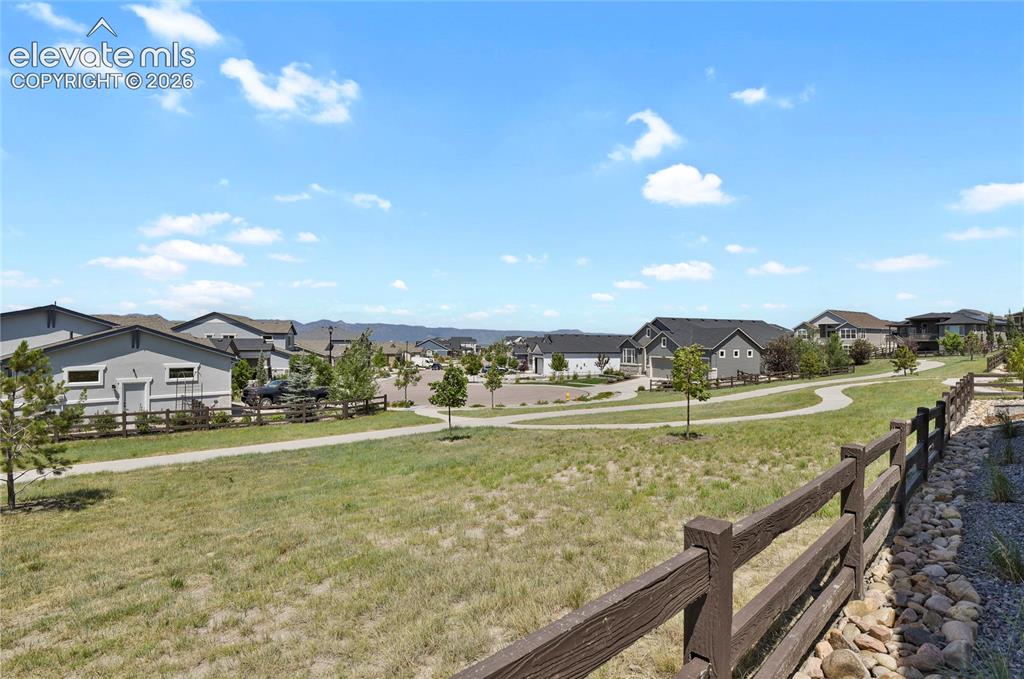 Image 30 of 42: Bordering community walking trails and open space