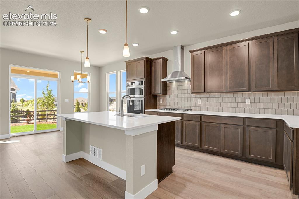 Image 5 of 42: Modern kitchen with large center island