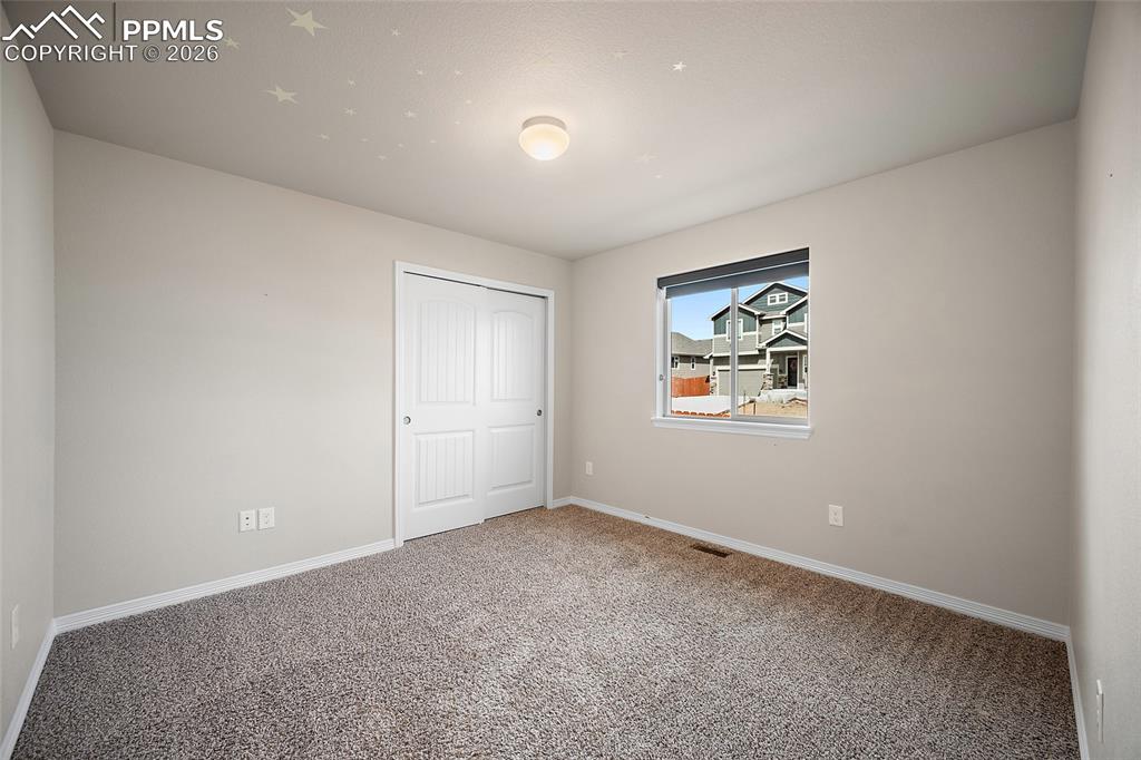 Image 25 of 50: Main level guest bedroom. 