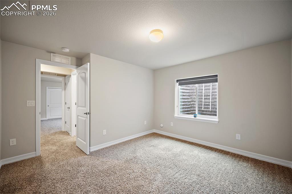Image 34 of 50: Basement bedroom