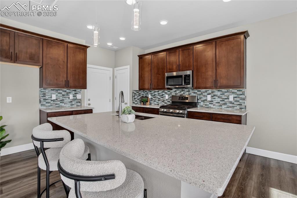 Image 4 of 17: Kitchen w/ SS appliances & upgraded Bosch dishwasher