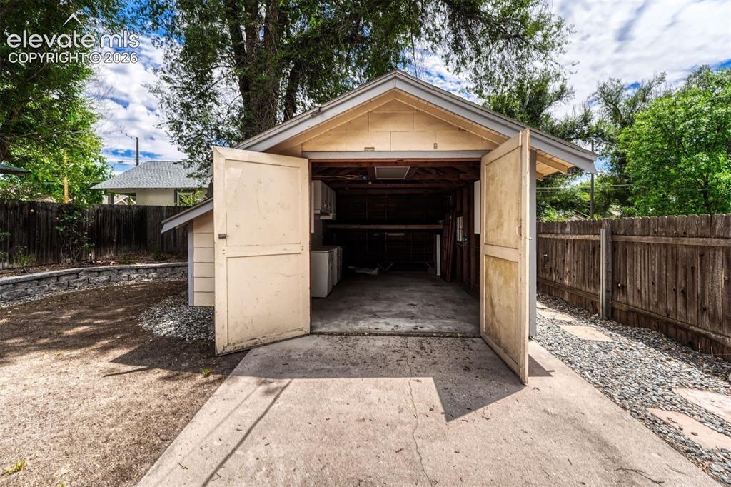 Image 11 of 42: 1 car garage has electricity and storage