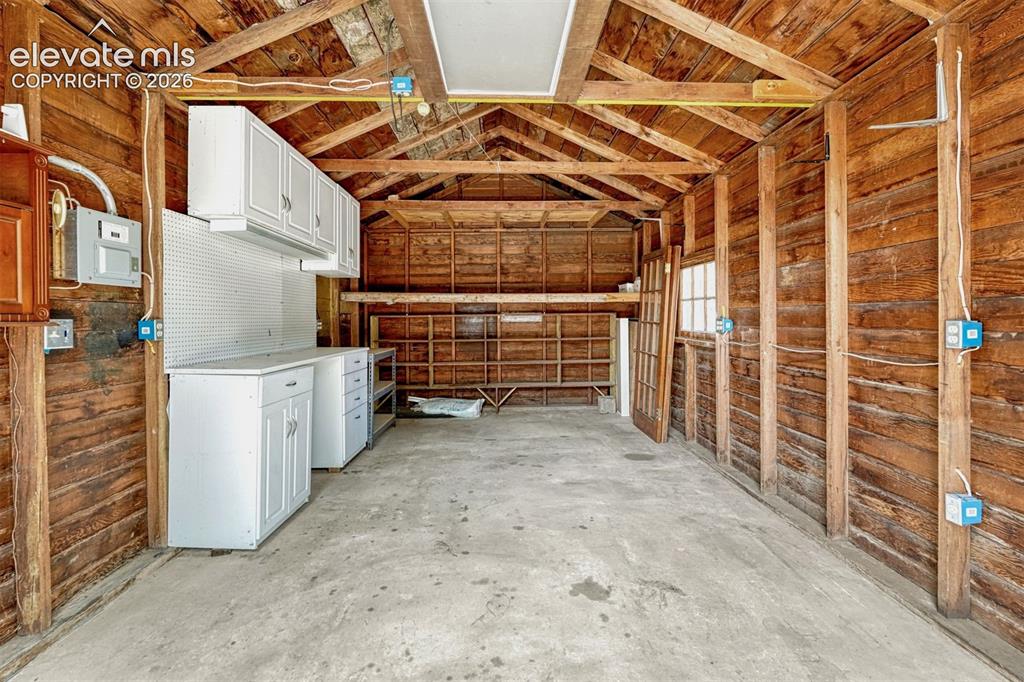 Image 12 of 42: Work bench and electricity in the 1 car garage